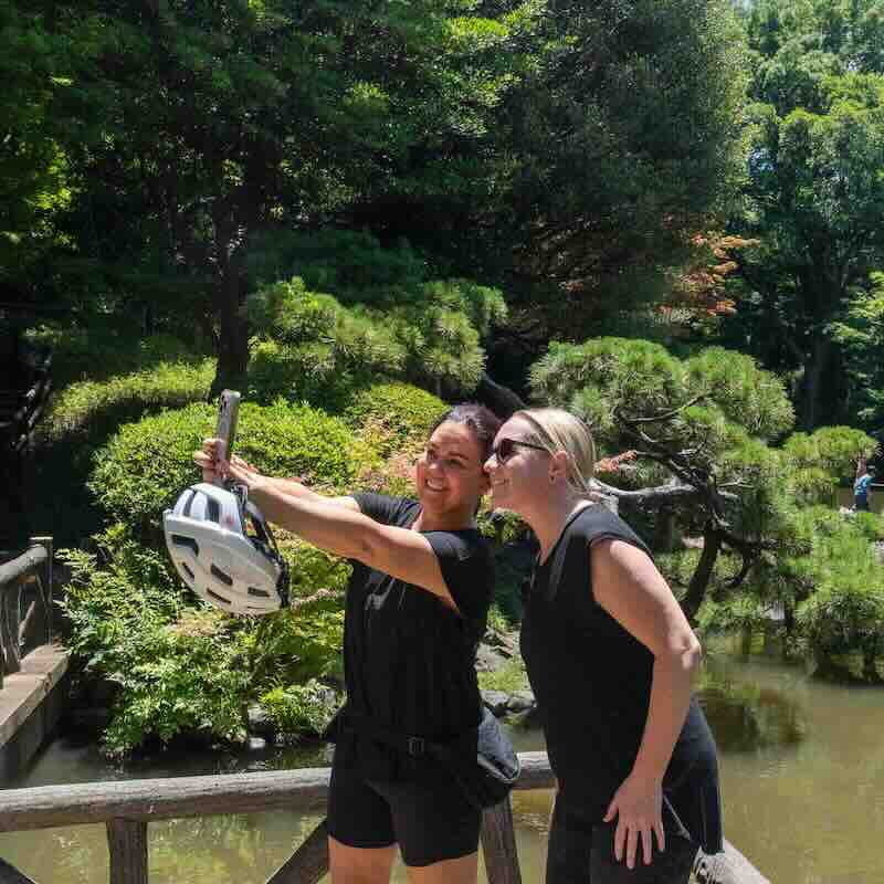 Happy person riding an e-bike in Tokyo